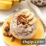A small jar of banana nut overnight oats, ready to eat.