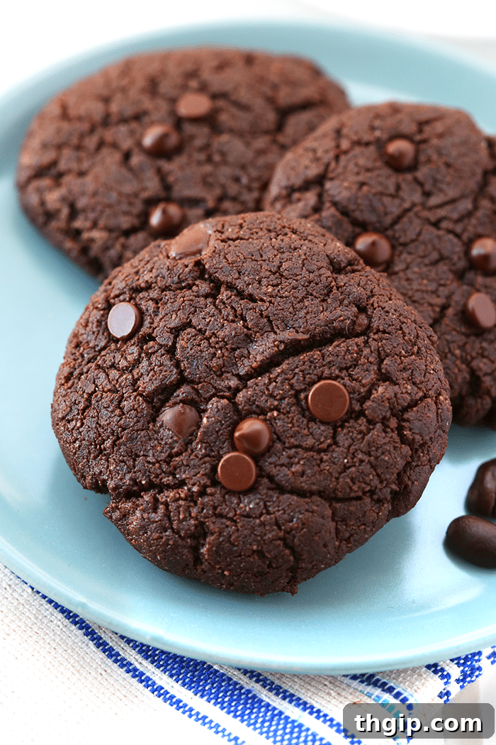 A perfectly arranged stack of healthy Double Chocolate Espresso Cookies with coffee beans in the background.
