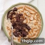 A bowl of chocolate almond butter overnight oats with chocolate shavings.