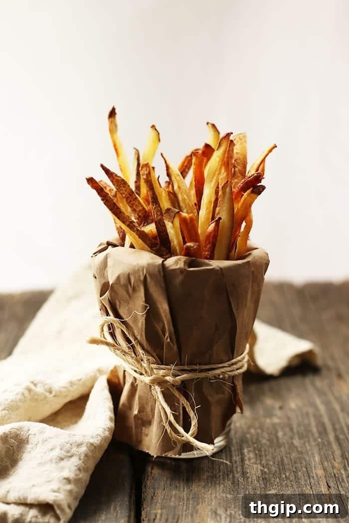 The secret to making crispy baked french fries in the oven is using avocado oil for its high smoke point and neutral flavor, ensuring golden results.