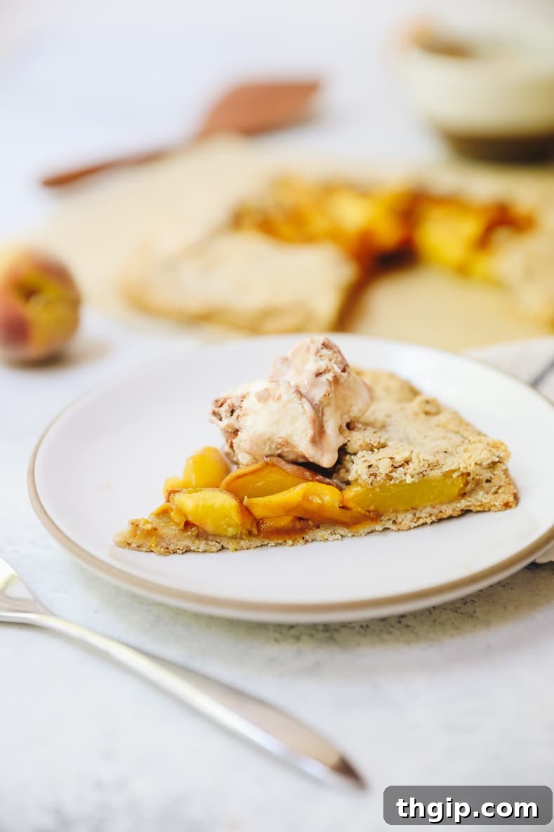 Rustic Vegan Peach Galette 2 Delicious Vegan Peach Galette ready to be served, showcasing its rustic crust and sweet peach filling.