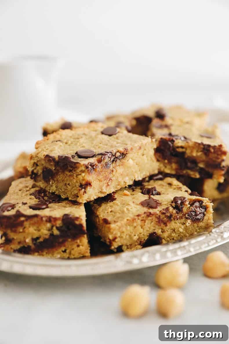 Wholesome Chickpea Blondies 3 Ingredients for healthy chickpea blondies, including chickpeas, nut butter, maple syrup, and vanilla, ready to be processed in a food processor.