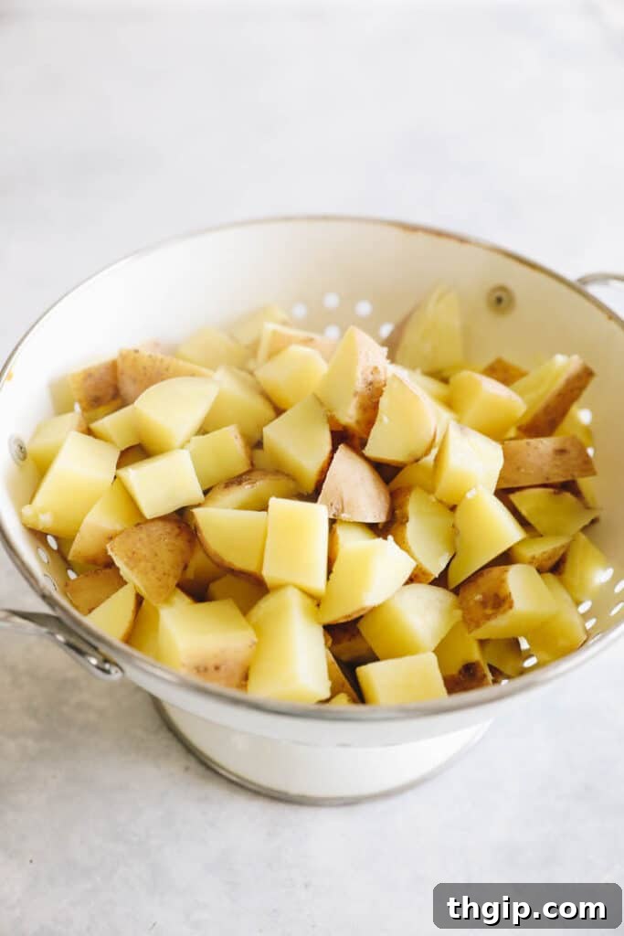 Crispy Roasted Potatoes: Two Mouthwatering Variations 3 Boiled potatoes drained and ready for seasoning.