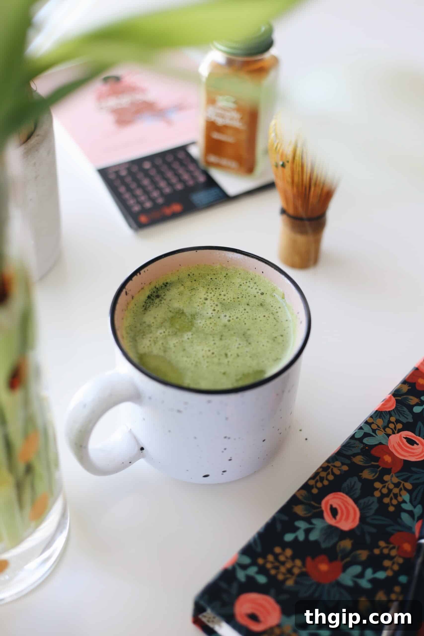 Turmeric Matcha Elixir 2 A beautifully crafted Matcha Turmeric Latte in a ceramic mug, with green matcha powder and golden turmeric spice blend visible. Perfect for a healthy morning boost.