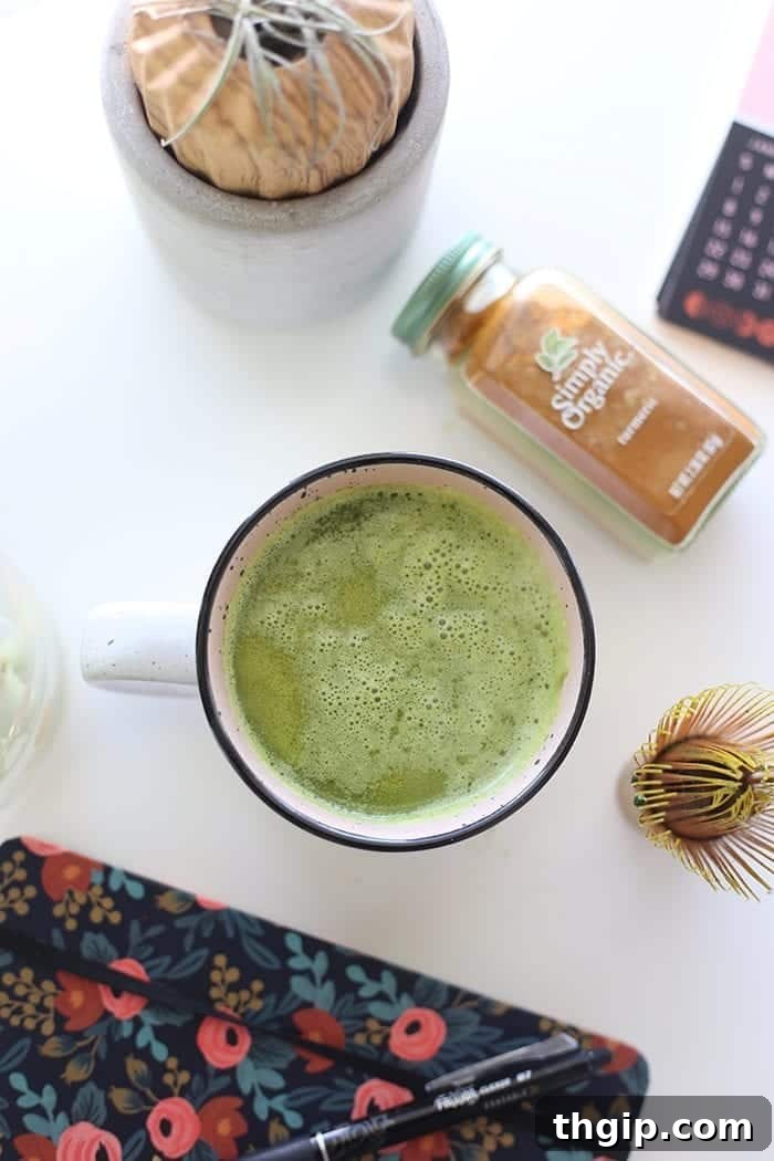 Turmeric Matcha Elixir 6 A final shot of the frothy, inviting Matcha Turmeric Latte, topped with a delicate sprinkle of matcha powder. A perfect healthy beverage.