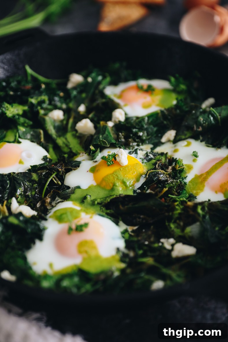 Vibrant Green Shakshuka Delights 6 A finished skillet of green shakshuka, topped with fresh herbs, crumbled feta cheese, and a drizzle of spicy sauce, ready to be enjoyed.