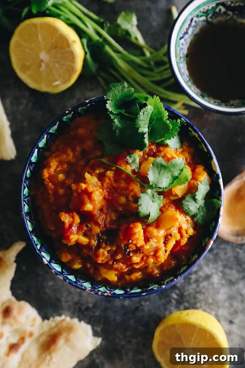 Root vegetable dal recipe in an Indian-style bowl with cilantro on top, ready to be served.