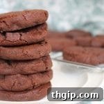 Triple Chocolate Sablés cookies on a cooling rack