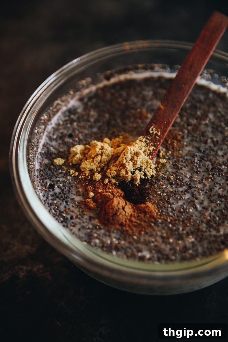 Spiced Gingerbread Chia Pudding 3 The ingredients for Gingerbread Chia Pudding being mixed in a mason jar.