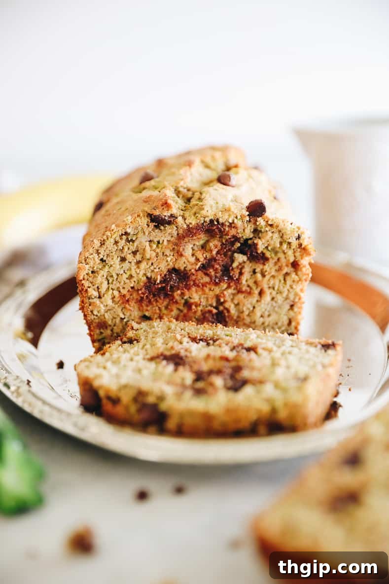 Wholesome Zucchini Banana Bread 2 Healthy Zucchini Banana Bread loaf, perfectly baked and golden brown.