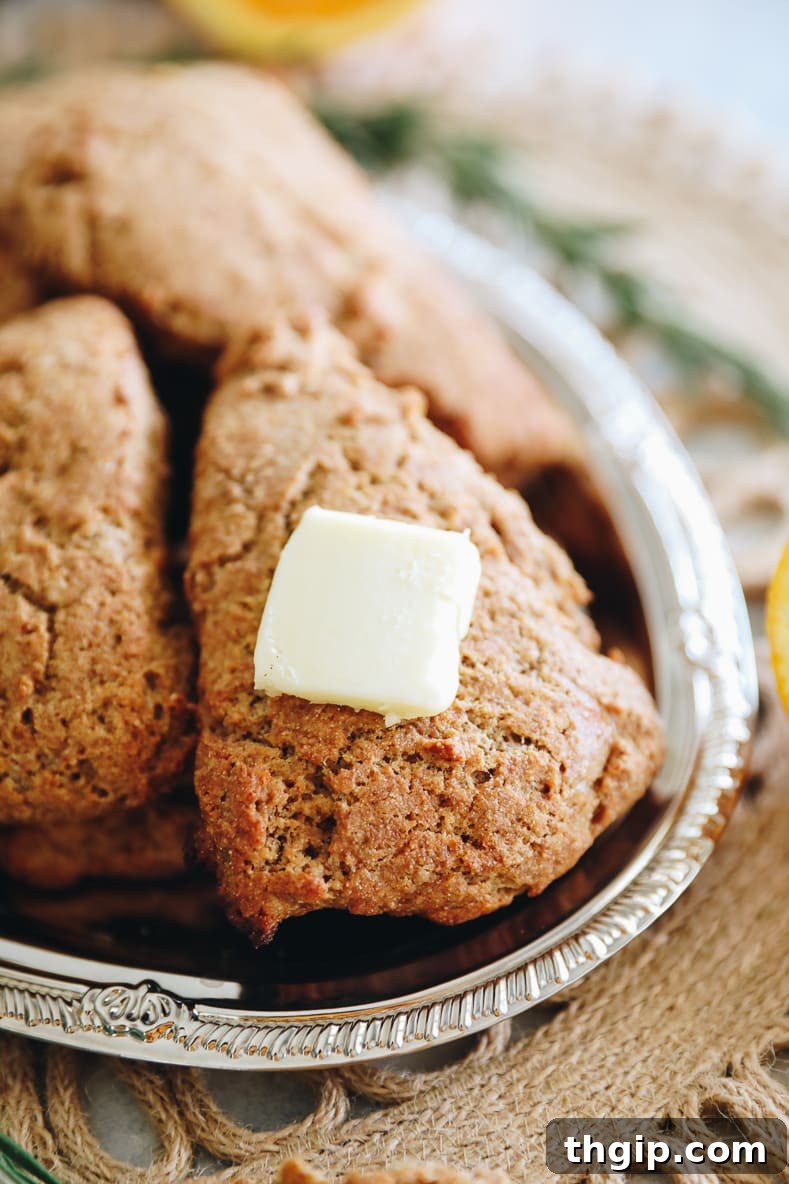 Zesty Orange Rosemary Scones 11 Baked orange rosemary scones, golden brown and ready to serve.