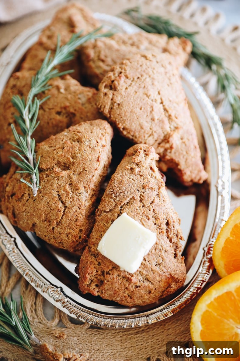 Zesty Orange Rosemary Scones 13 A delicious orange rosemary scone, ready to be enjoyed.
