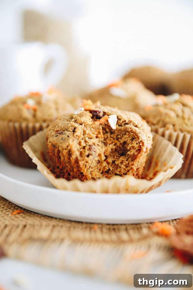 Baked Morning Glory Muffins cooling on a wire rack.