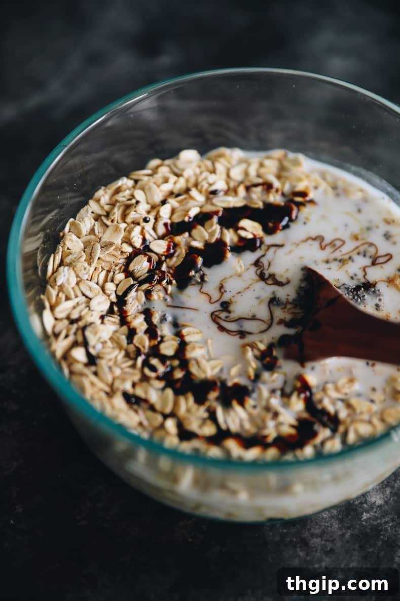 Cozy Gingerbread Overnight Oats 4 Mixture of gingerbread overnight oats in clear bowl before soaking overnight.