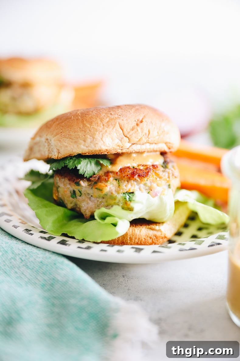 Zesty Thai Turkey Burgers with Peanut Drizzle 2 Delicious Thai Turkey Burgers topped with a creamy peanut sauce, fresh cilantro, and lettuce on a toasted bun.