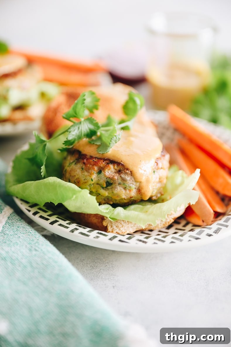 Zesty Thai Turkey Burgers with Peanut Drizzle 6 Assembled Thai Turkey Burgers on toasted buns with lettuce and a generous drizzle of peanut sauce.