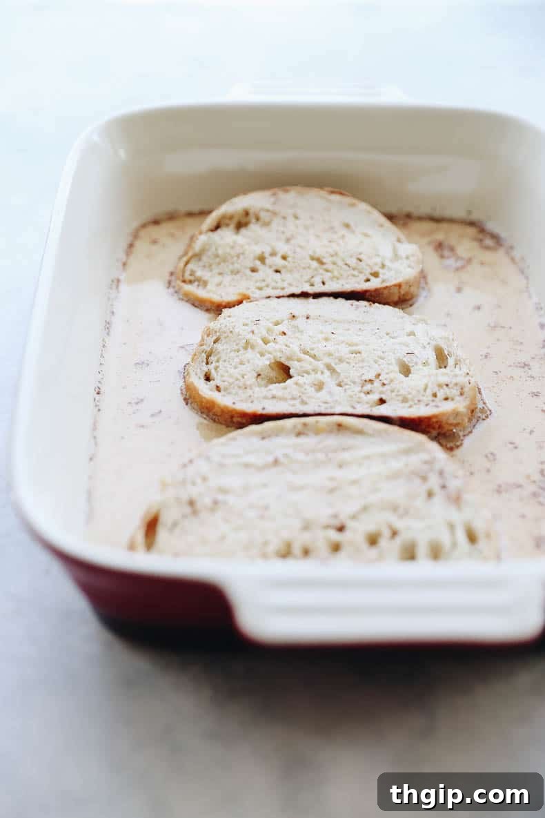 A close-up shot of the healthy French toast batter in a shallow dish, ready for bread to be soaked.