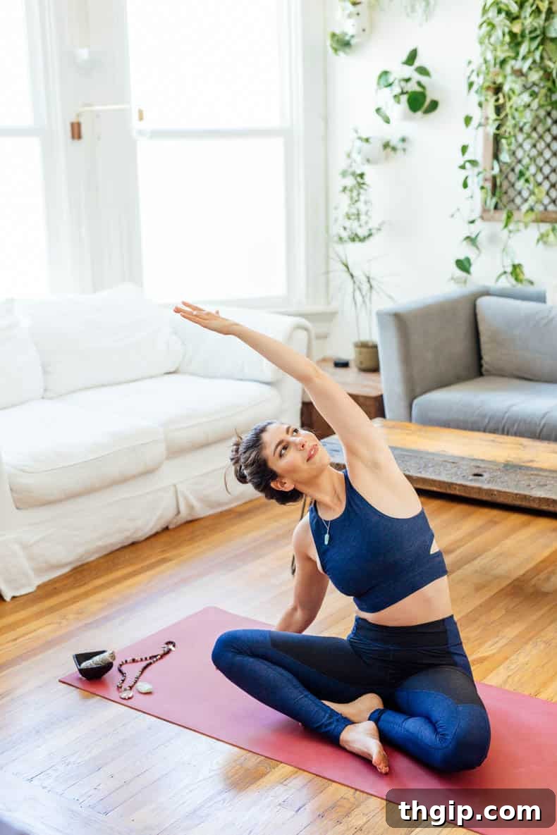 Homemade Yoga Mat Refresher 4 yoga teacher Davida Lederle sitting on her yoga mat with her yoga mat cleaner
