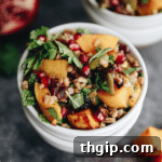 Delicious Harvest Farro Salad with roasted butternut squash and pomegranate molasses dressing, a perfect fall dish.