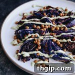 A small image thumbnail of roasted cabbage steaks with chickpeas and creamy herb sauce.