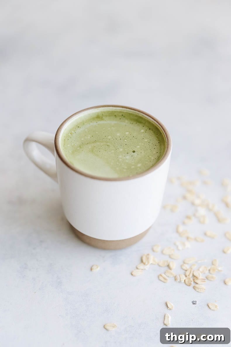 This Matcha Oat Milk Latte gives the caffeine boost and earthy flavors of matcha mixed with the sweetness of oat milk. #oatmilk #latte