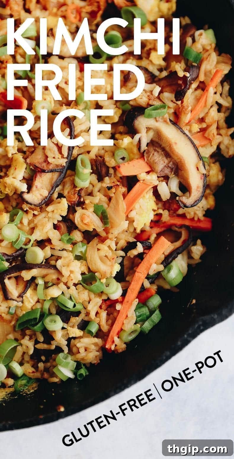Get in your fried rice kick with an added nutritional boost in this healthy kimchi fried rice. A perfect easy weeknight dinner or enjoy as leftovers for lunch the next day! Plus only one-pan required. #kimchi #friedrice #healthy