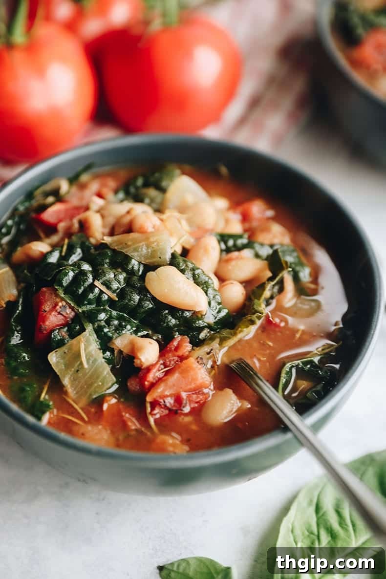 24 Comforting Plant-Based Soups 2 A vibrant bowl of Tuscan white bean soup, garnished and ready to be enjoyed.