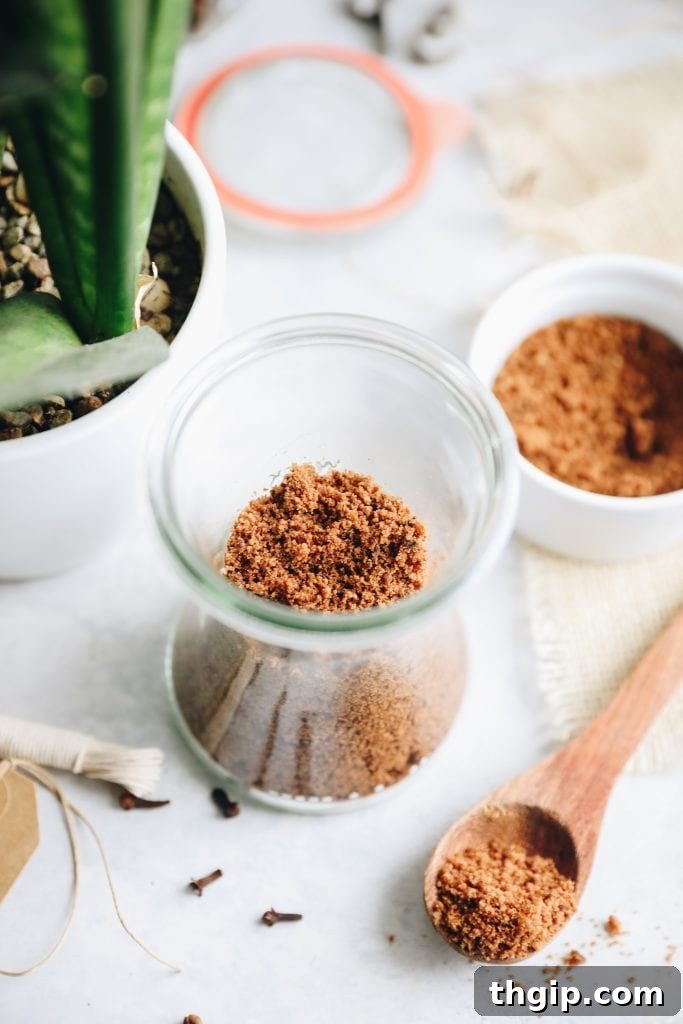 Three glass jars of Gingerbread Sugar Scrub lined up, showcasing the festive packaging potential for holiday gifts.