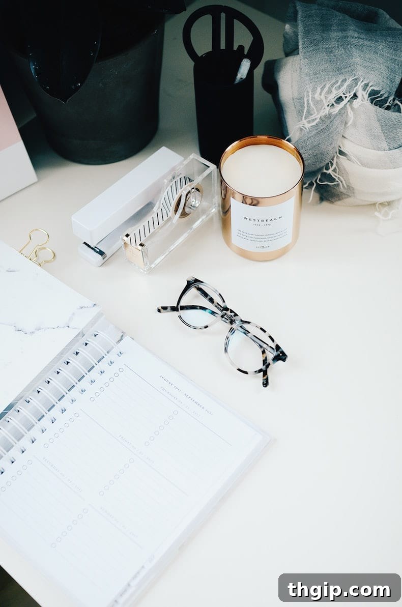 Unlock Remote Success: 10 Essential WFH Hacks 2 Person working from home with a laptop and a cup of coffee