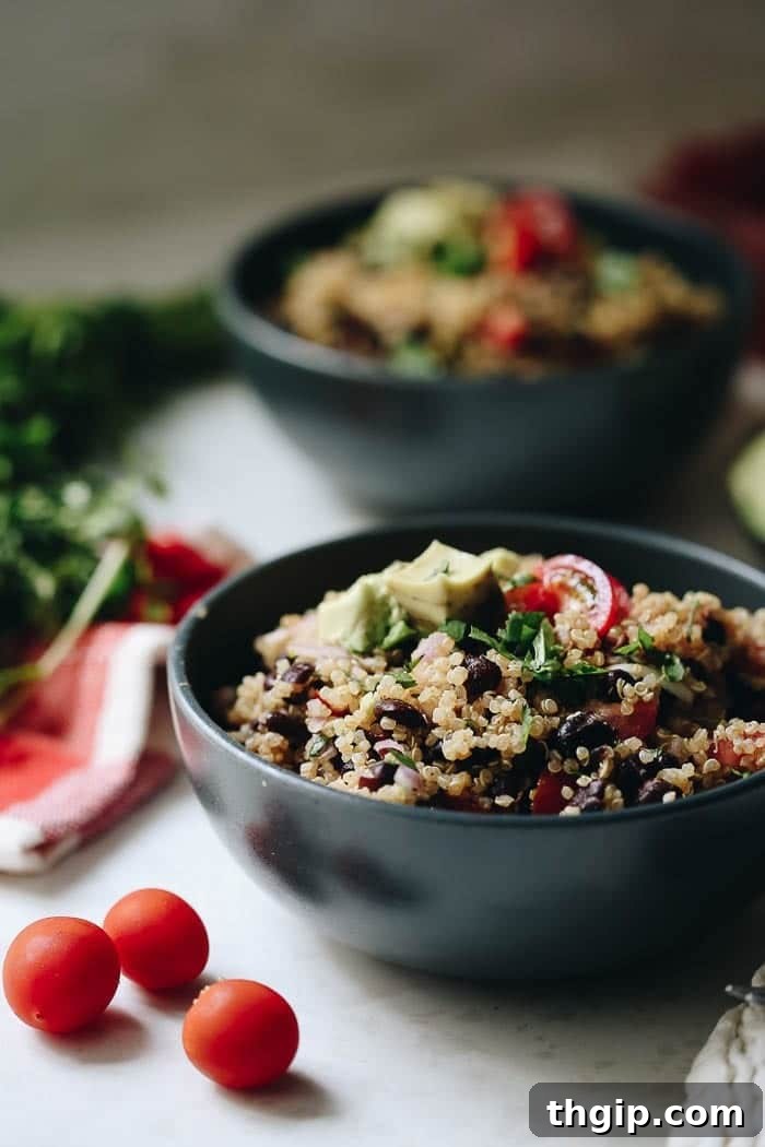 30 Recipes Using What's In Your Pantry 4 A hearty and colorful quinoa taco salad served in a bowl, featuring corn, beans, avocado, and fresh cilantro, offering a complete and healthy meal.