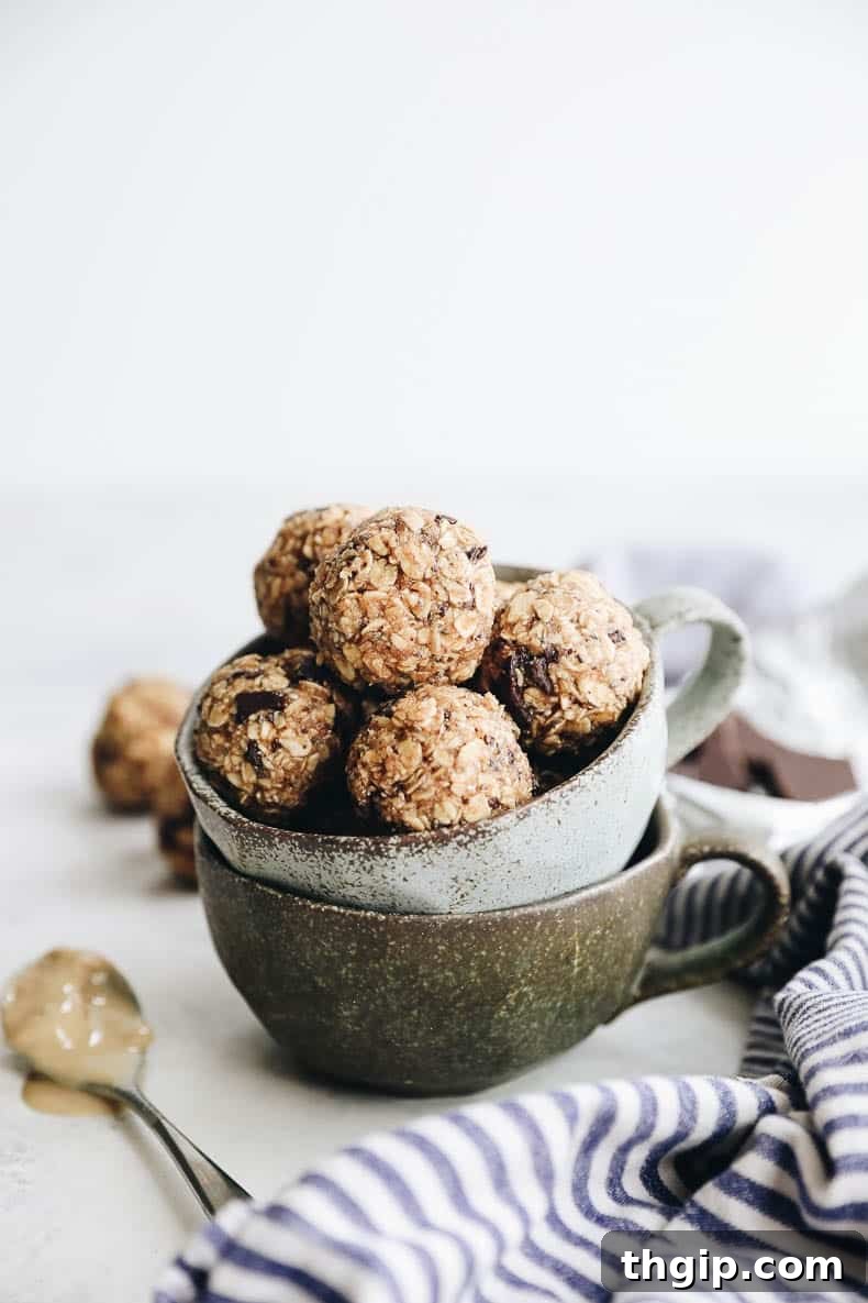 30 Recipes Using What's In Your Pantry 5 A stack of golden brown no-bake tahini energy balls, drizzled with chocolate and garnished with sesame seeds, presented as a healthy and quick snack.