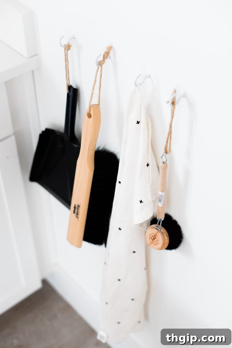 9 Spring Cleaning Spots You're Definitely Missing 2 Woman wiping down a plant leaf
