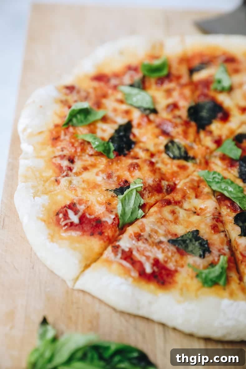 Perfect Homemade Pizza Dough Recipe 2 A beautifully baked homemade Margherita pizza with fresh basil