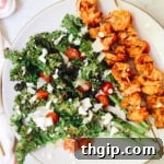 Grilled Kale Caesar Salad with Spicy Shrimp on a plate
