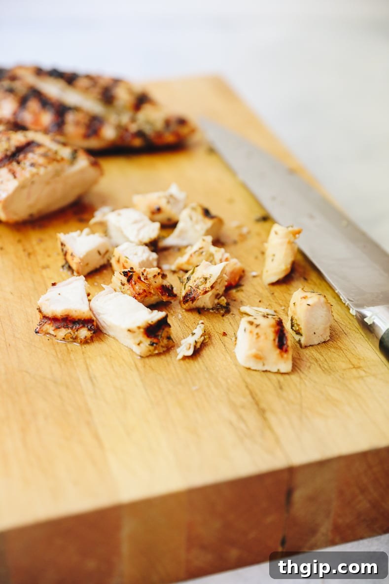 Lagoon Fresh Salad 7 Sliced grilled chicken breasts on a cutting board