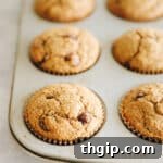 Golden-brown oat flour muffins nestled in a muffin tin, ready to be enjoyed as a healthy and satisfying treat.