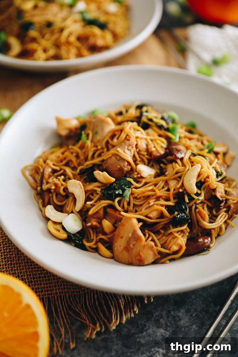 Plate of Orange Sesame Noodles with Chicken and Vegetables