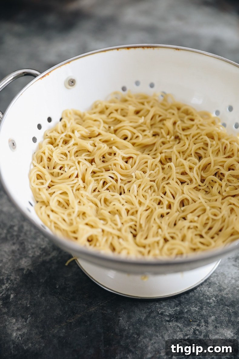 Cooked ramen noodles in a colander