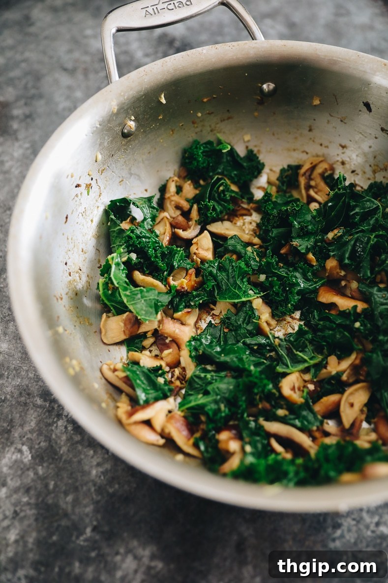 Mushrooms, garlic, and ginger cooking in a pan