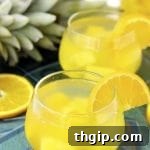 Tropical Coconut Sangria recipe card image.