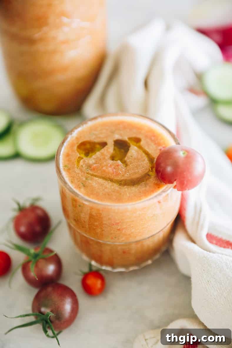 Simple Summer Gazpacho 7 A refreshing glass of gazpacho soup with fresh garnishes.