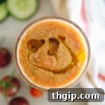 Overhead shot of a glass of tomato gazpacho.