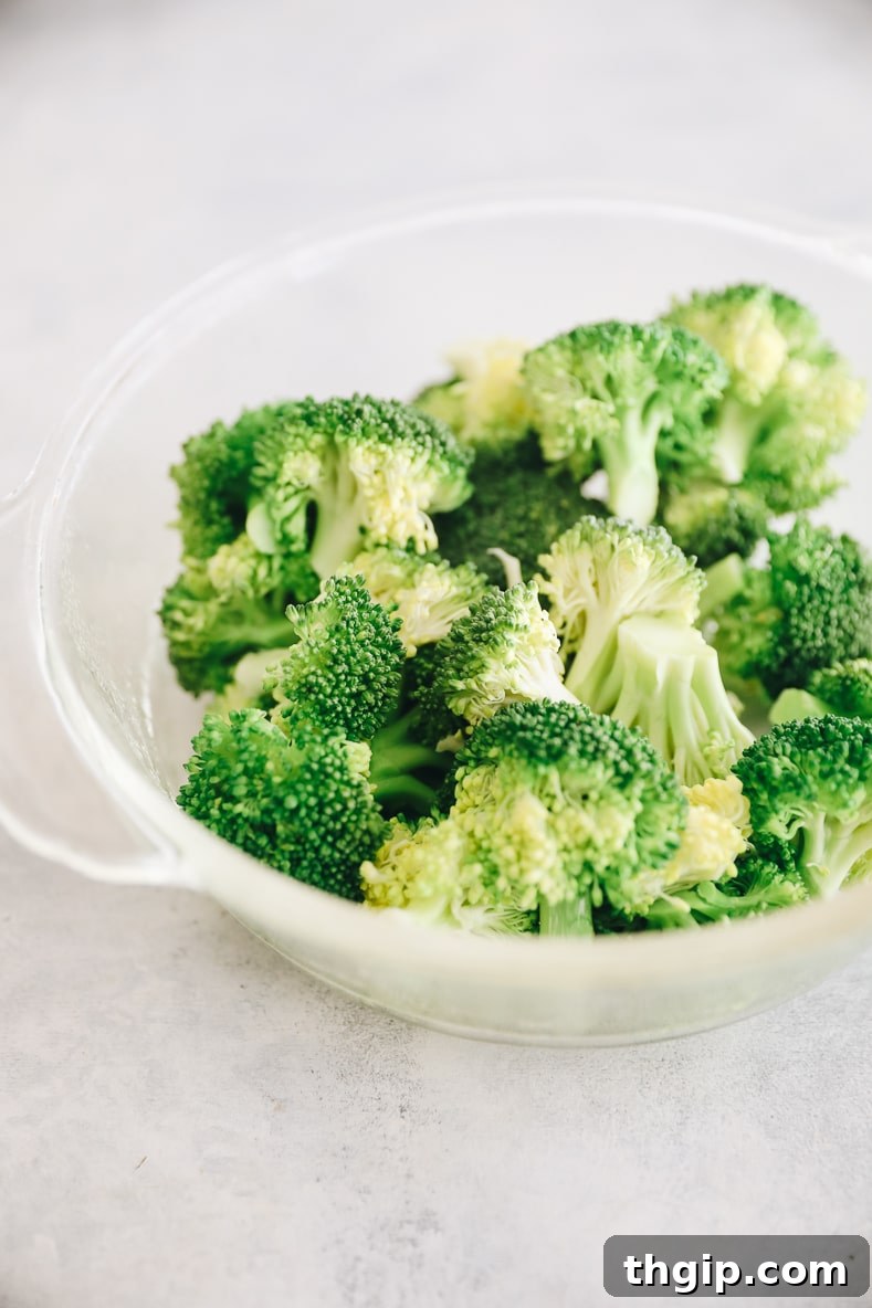 Crispy Broccoli Cheddar Bites 3 Fresh broccoli florets being cooked in a pot on the stove.