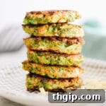 Delicious golden brown broccoli cheddar fritters on a plate.