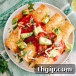 Crispy Instant Pot Chicken Taquitos topped with salsa, avocado, and cheese.