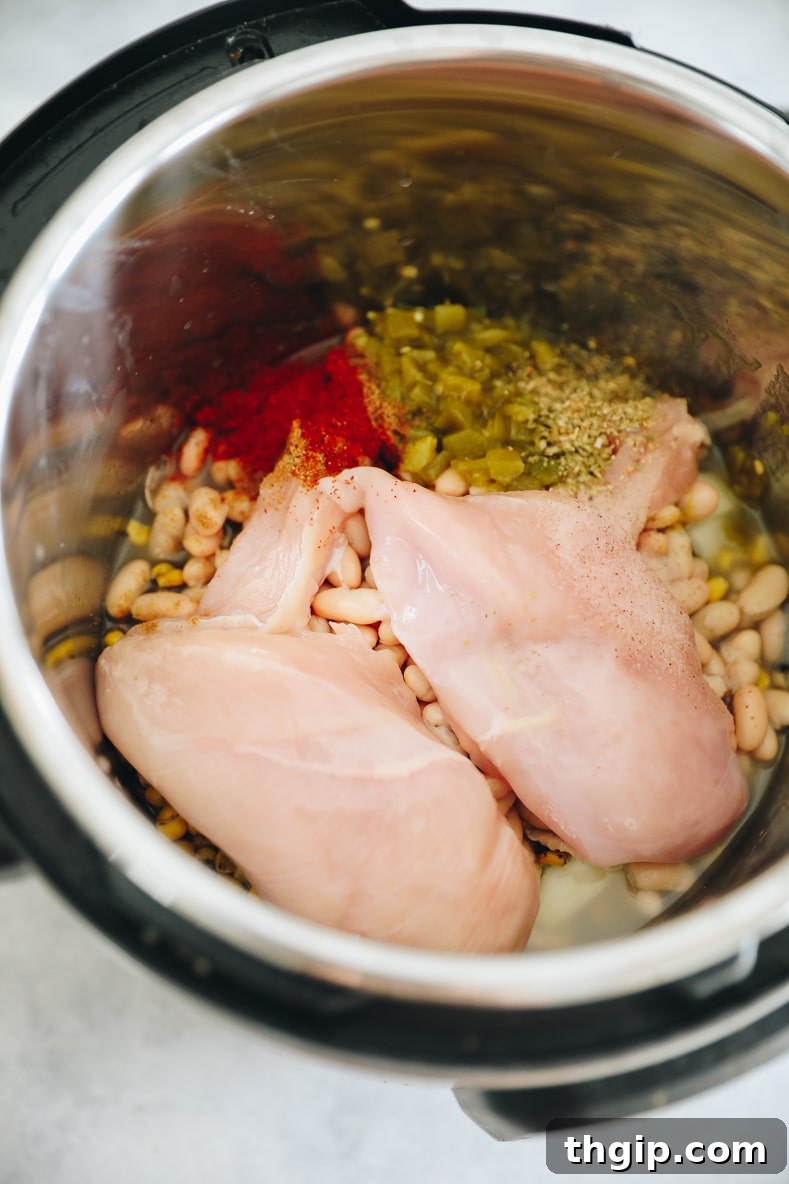 Creamy Instant Pot White Chicken Chili 3 All ingredients layered in the Instant Pot before cooking.