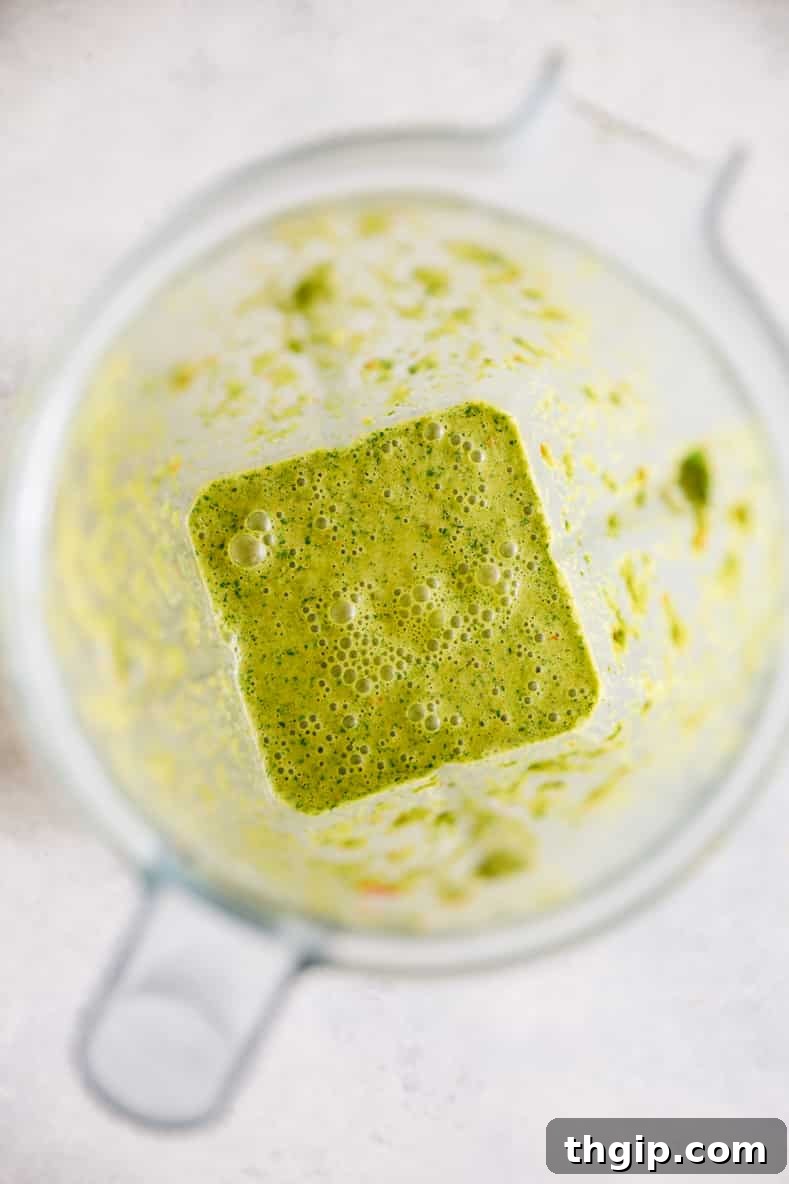 Ingredients for the spicy green sauce blending in a food processor.
