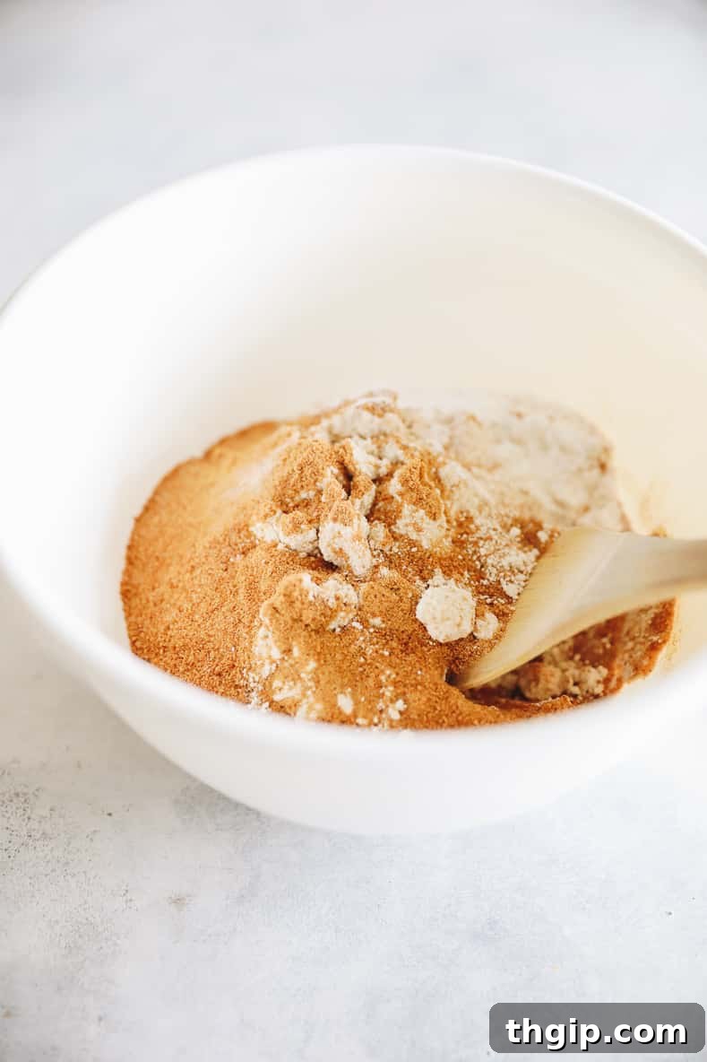 Dry ingredients for oat flour muffins mixed in a bowl.
