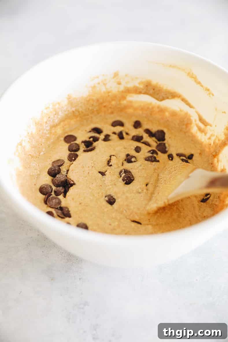 Wet ingredients for oat flour muffins mixed in a bowl.