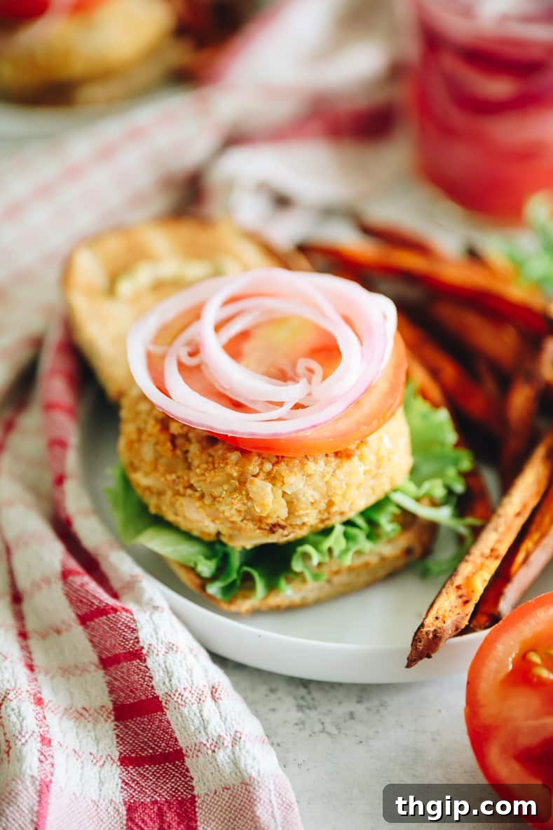 Wholesome Quinoa Veggie Burgers 7 A finished quinoa burger, assembled with toppings on a bun.